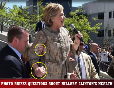 Hillary Cllinton being held upright by man while speaking