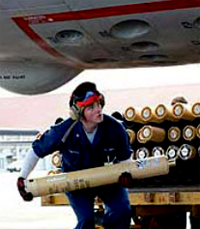 Sailor loads sonobouys into aircraft